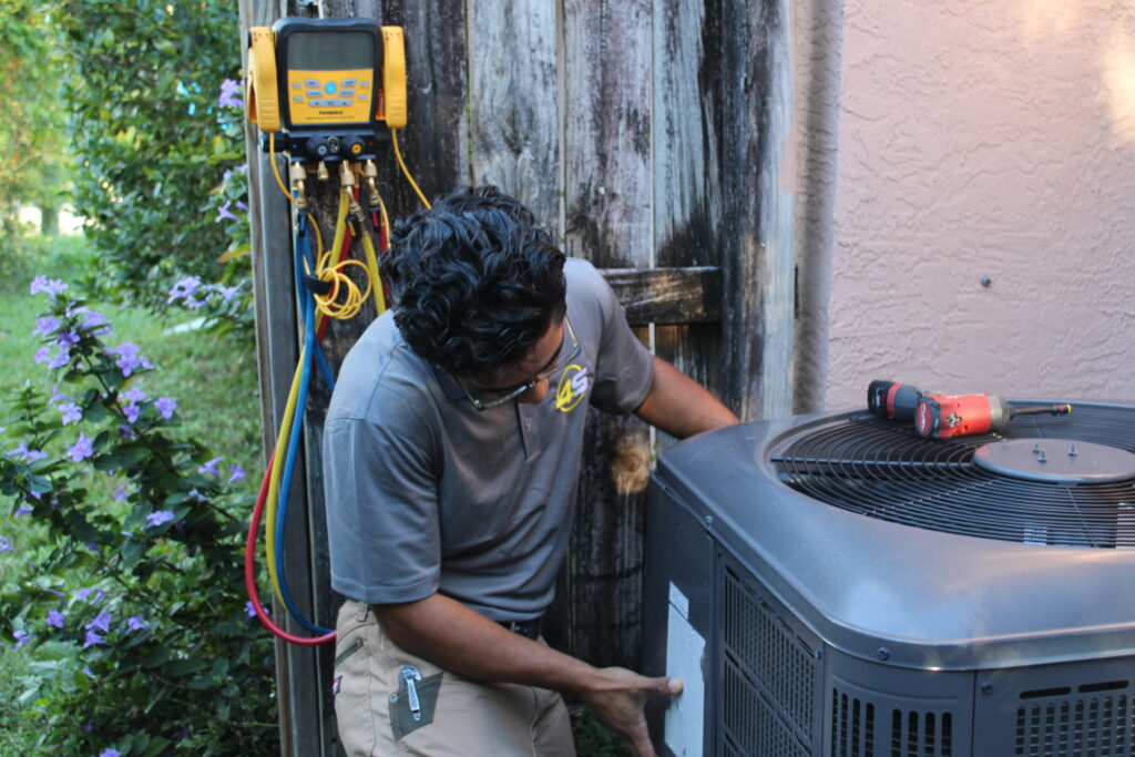 Tech Working On Unit 13